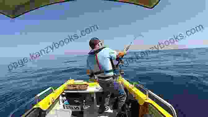 Man In A Boat Surrounded By Fish Living Off The Sea Nino Zoccali